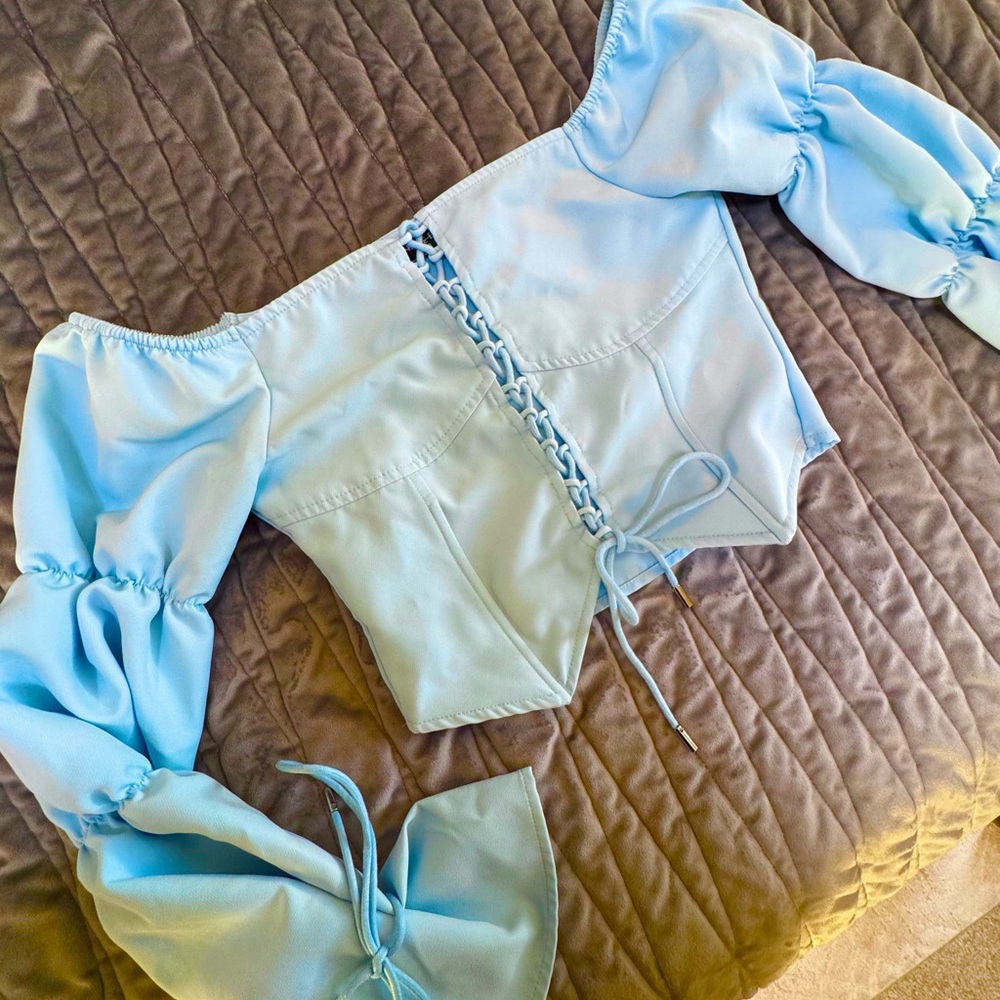 Maniere De Voir Sky Blue Off-Shoulder Blouse with Ties for versatile sizing